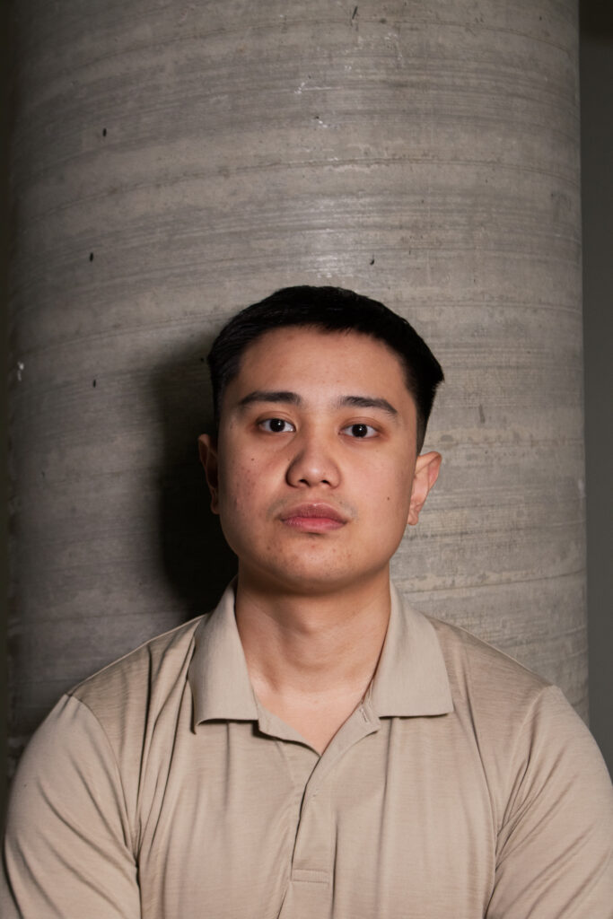 Edgardo standing in front of a large pillar, reflecting what Amplora is all about—focus, professionalism, and dedication. His presence represents the team’s drive to provide reliable and exceptional service.