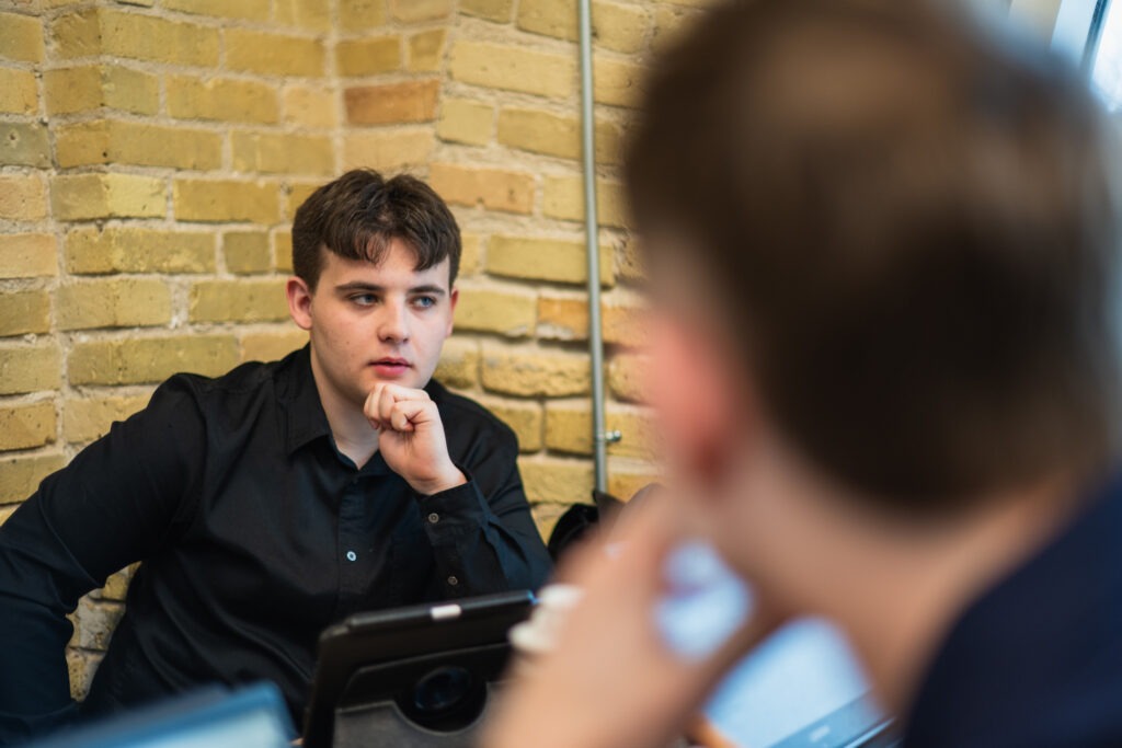 Max sits in a quiet corner at The Forks, laptop open and surrounded by the lively energy of Winnipeg’s heart. He's deep in thought, outlining how Amplora's web design solutions can help businesses stand out online. His focus is clear: to create websites that not only captivate but also convert visitors into loyal customers.